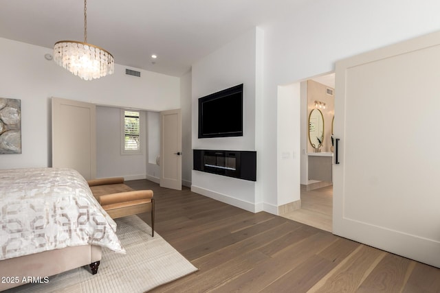 22756 N 91st Way, Scottsdale, AZ 85255 - bedroom with a chandelier, wood finished floors, baseboards, and recessed lighting