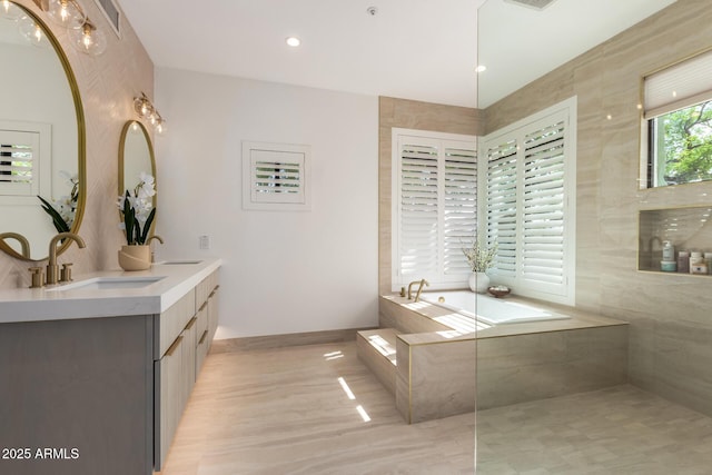 22756 N 91st Way, Scottsdale, AZ 85255 - bathroom featuring double vanity, a bath, and baseboards