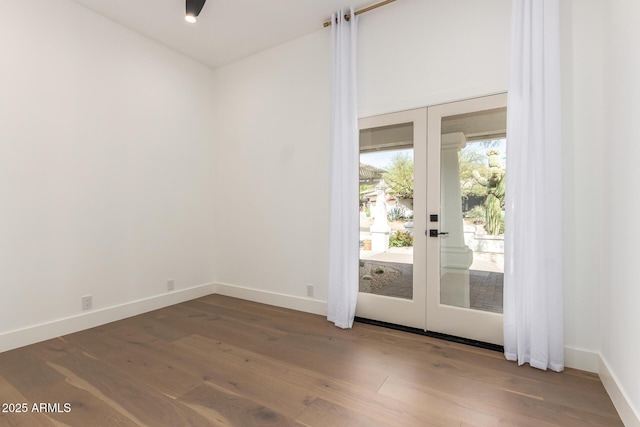 22756 N 91st Way, Scottsdale, AZ 85255 - unfurnished room featuring french doors, wood finished floors, and baseboards
