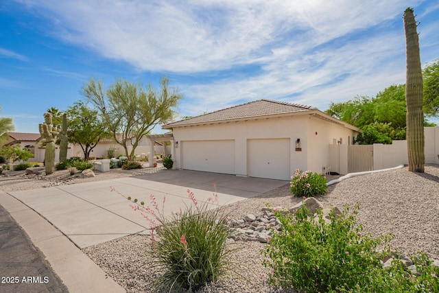 22756 N 91st Way, Scottsdale, AZ 85255 - view of home's exterior featuring a tile roof, stucco siding, concrete driveway, and an attached garage