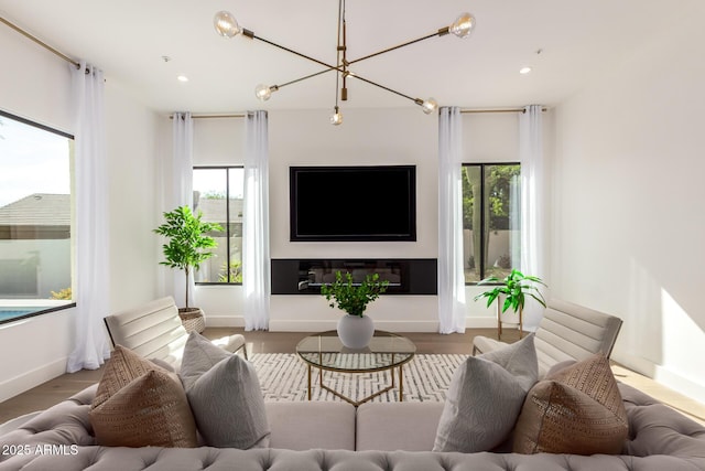 22756 N 91st Way, Scottsdale, AZ 85255 - living room featuring healthy amount of natural light, wood finished floors, a chandelier, recessed lighting, and baseboards
