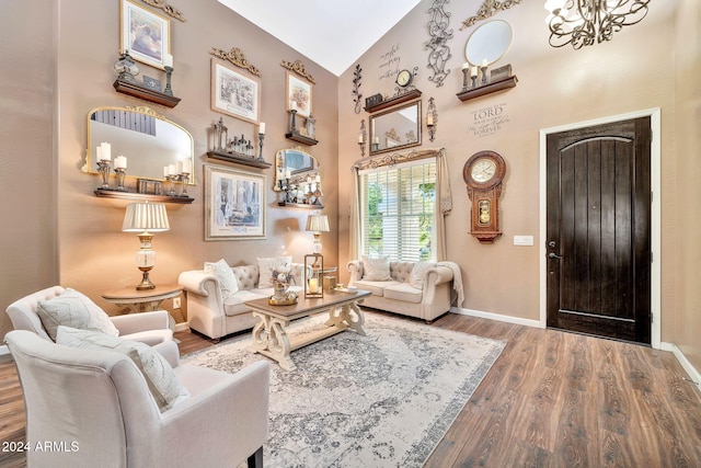 living room with hardwood / wood-style flooring and high vaulted ceiling