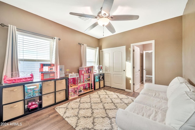 recreation room featuring light wood-type flooring and ceiling fan