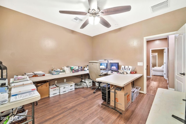 office space featuring ceiling fan and hardwood / wood-style floors