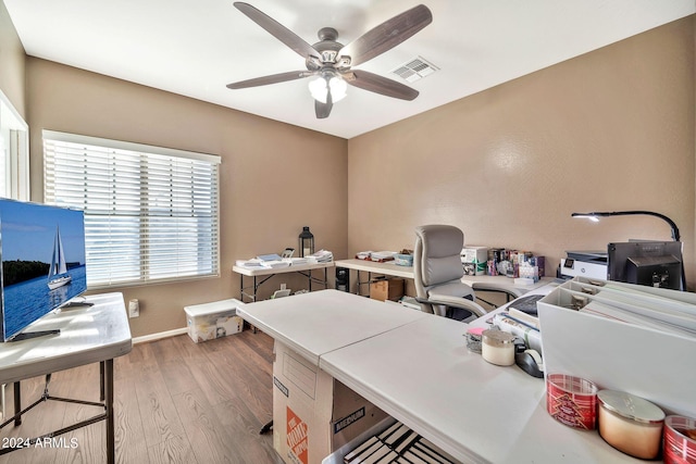 office space featuring light wood-type flooring and ceiling fan