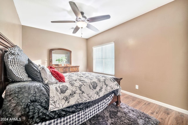 bedroom featuring hardwood / wood-style flooring and ceiling fan