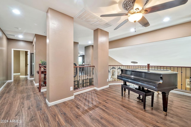 miscellaneous room featuring ceiling fan and dark hardwood / wood-style flooring