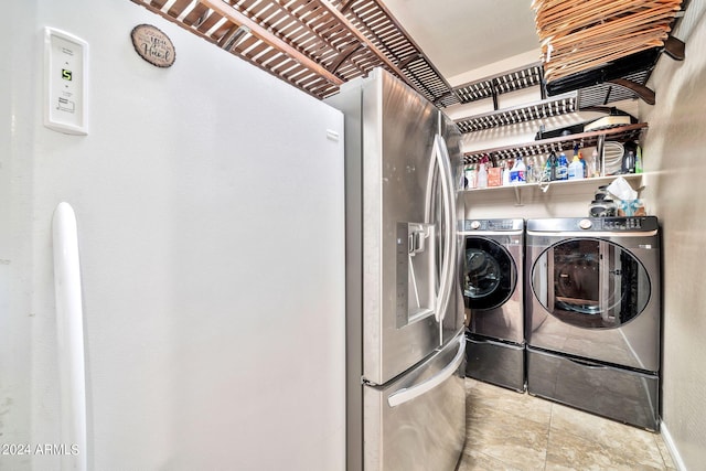 clothes washing area featuring washing machine and clothes dryer