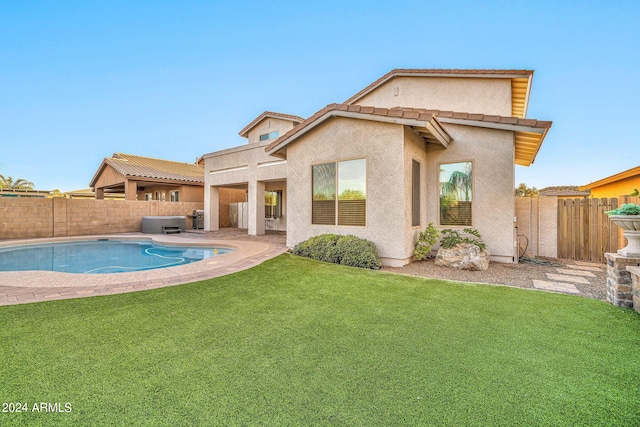 view of swimming pool with a yard and a patio area