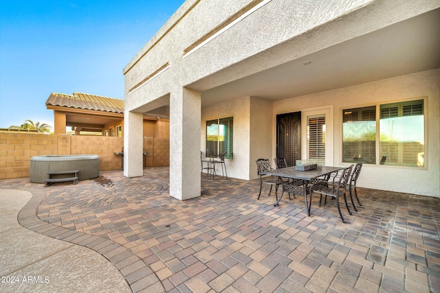 view of patio / terrace featuring a hot tub