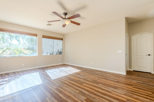 spare room featuring ceiling fan and wood-type flooring