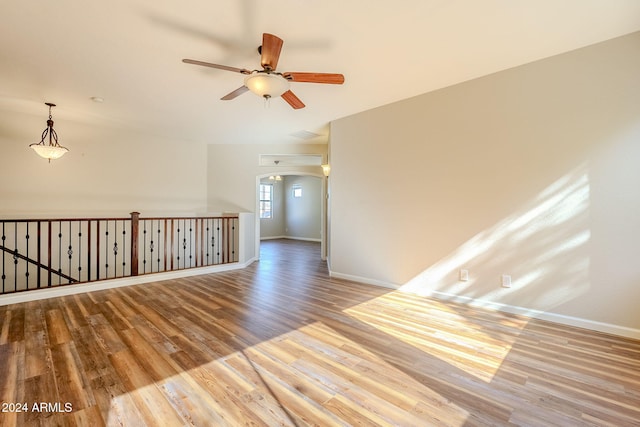 spare room with light hardwood / wood-style floors and ceiling fan