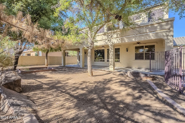 rear view of house with a patio area and ceiling fan