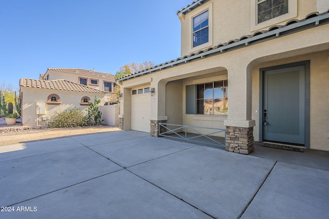 view of side of home with a garage