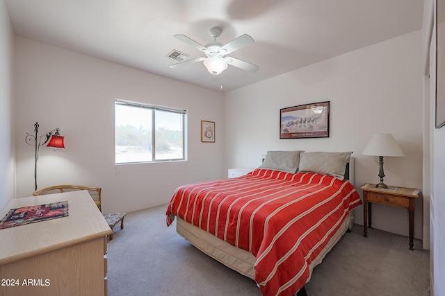 bedroom with ceiling fan and carpet floors