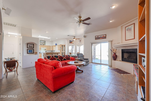 living room featuring tile patterned flooring and ceiling fan