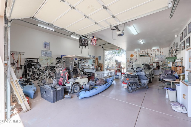 1880 W Roderick Ln, Wickenburg, AZ 85390 - garage with a garage door opener and a workshop area
