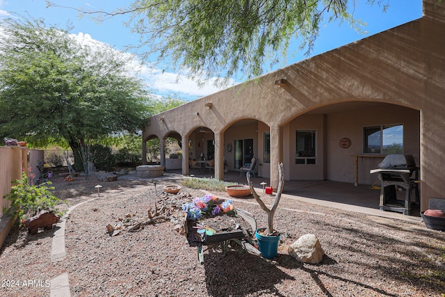 rear view of property featuring a patio