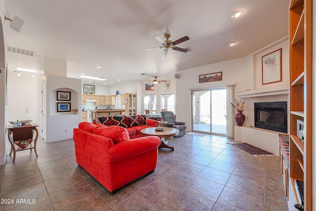 1880 W Roderick Ln, Wickenburg, AZ 85390 - living room with visible vents, ceiling fan, a fireplace with raised hearth, recessed lighting, and tile patterned flooring