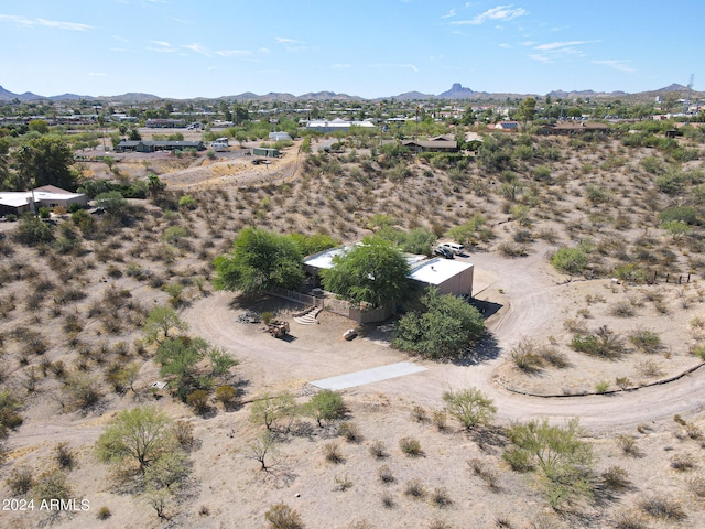 birds eye view of property featuring a mountain view