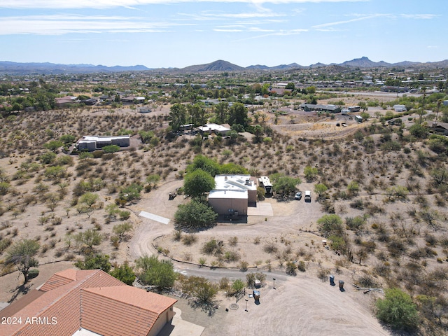 birds eye view of property with a mountain view