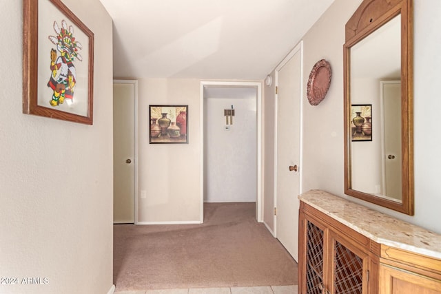 hallway with light carpet