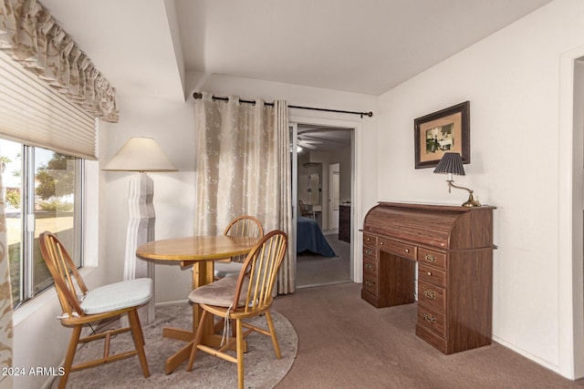 view of carpeted dining area