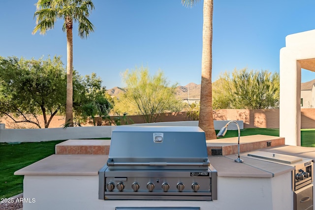 view of patio featuring area for grilling and a mountain view