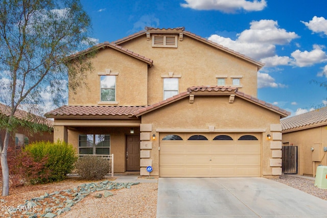 mediterranean / spanish home featuring a garage and a porch