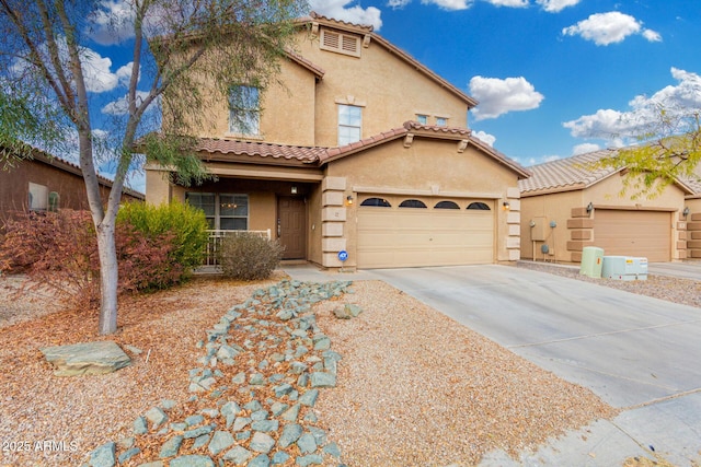 mediterranean / spanish-style house featuring a garage