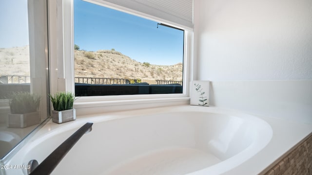 bathroom featuring a mountain view