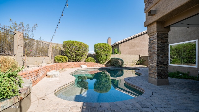 view of pool featuring a patio area