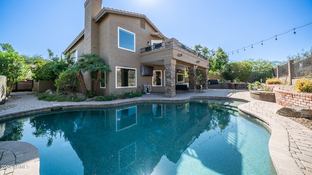 view of swimming pool featuring a patio area