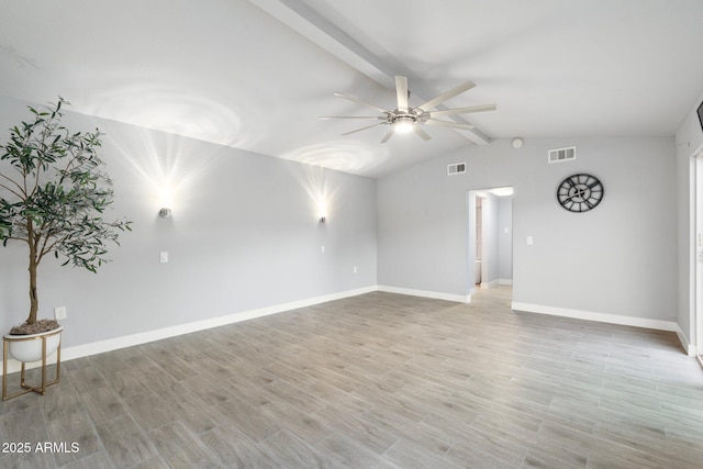 spare room featuring ceiling fan, light wood-style floors, and baseboards