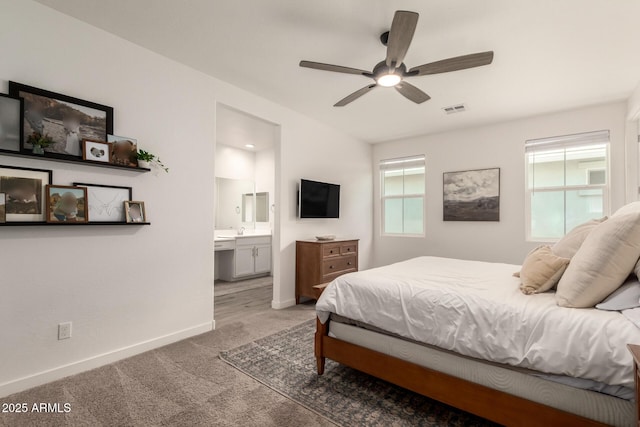 5460 S Dillon Cir, Mesa, AZ 85212 - carpeted bedroom with baseboards, connected bathroom, and a ceiling fan