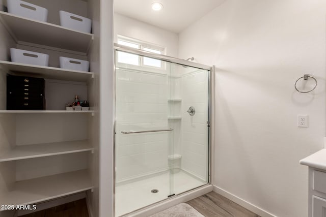5460 S Dillon Cir, Mesa, AZ 85212 - bathroom with wood finished floors, a shower stall, baseboards, and vanity
