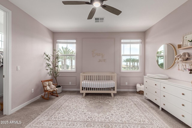 5460 S Dillon Cir, Mesa, AZ 85212 - carpeted bedroom with a nursery area, baseboards, and a ceiling fan