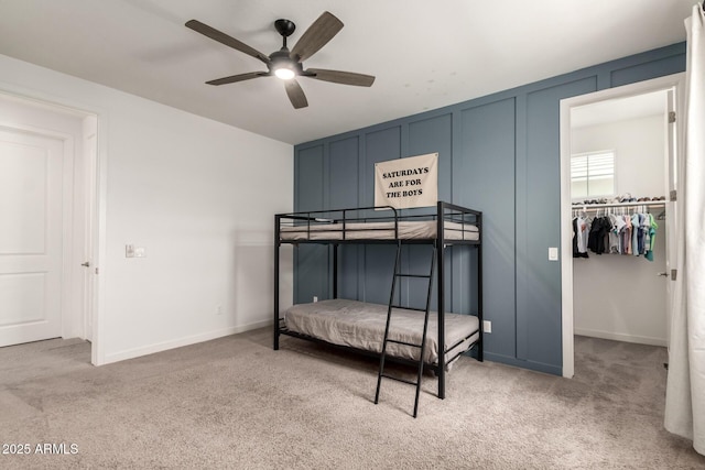 5460 S Dillon Cir, Mesa, AZ 85212 - carpeted bedroom with a walk in closet, a ceiling fan, baseboards, and a closet