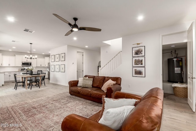 5460 S Dillon Cir, Mesa, AZ 85212 - living area featuring recessed lighting, ceiling fan, electric water heater, light wood finished floors, and a chandelier