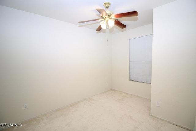 unfurnished room with ceiling fan and carpet floors