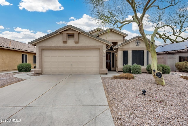 ranch-style house featuring a garage, driveway, a tiled roof, and stucco siding