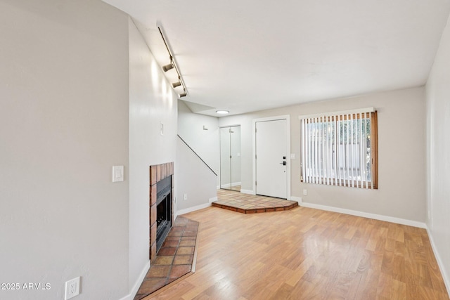 2815 N 52nd St Unit 3, Phoenix, AZ 85008 - entrance foyer with light wood-type flooring and a brick fireplace