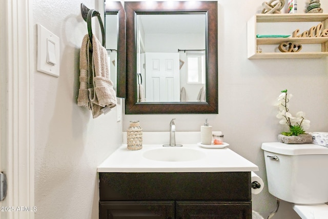 half bathroom with toilet and vanity