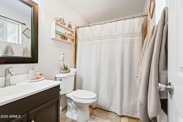 bathroom featuring curtained shower, toilet, and vanity