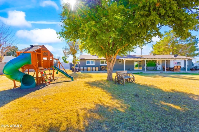 view of jungle gym featuring a yard