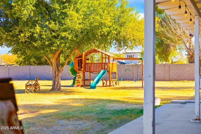 view of jungle gym featuring a yard and a fenced backyard