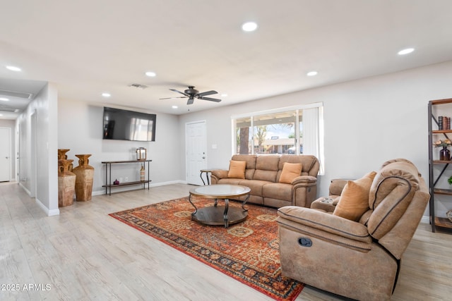 living area with a ceiling fan, visible vents, light wood finished floors, baseboards, and recessed lighting