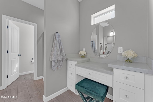 bathroom featuring vanity and hardwood / wood-style floors