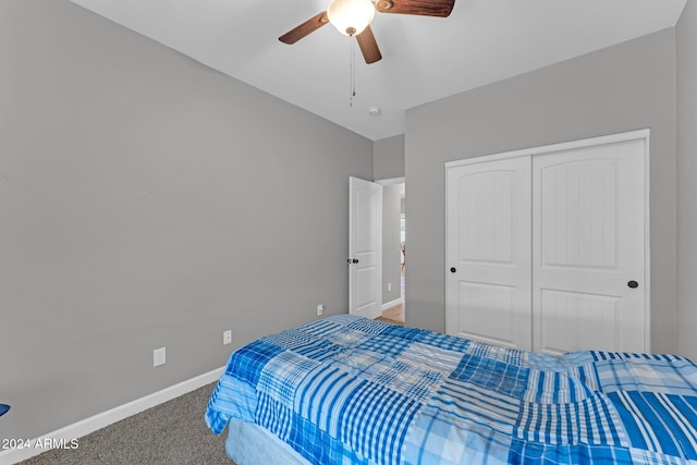 carpeted bedroom with a closet and ceiling fan