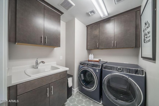 12233 W Caraveo Pl, Peoria, AZ 85383 - laundry room with cabinet space, washer and clothes dryer, and baseboards